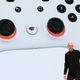 A Stadia exec shows the controller on stage at Google's big showcase.
